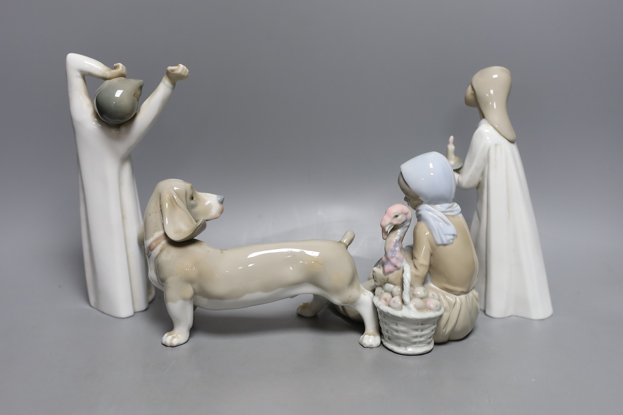 Four Lladro porcelain figures, tallest 22 cm